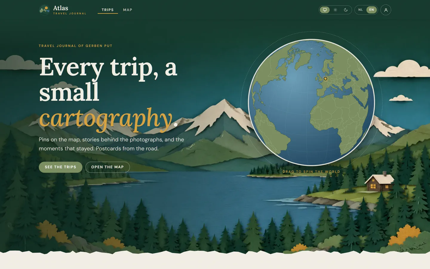 Home page: a papercut landscape with the draggable globe as the moon